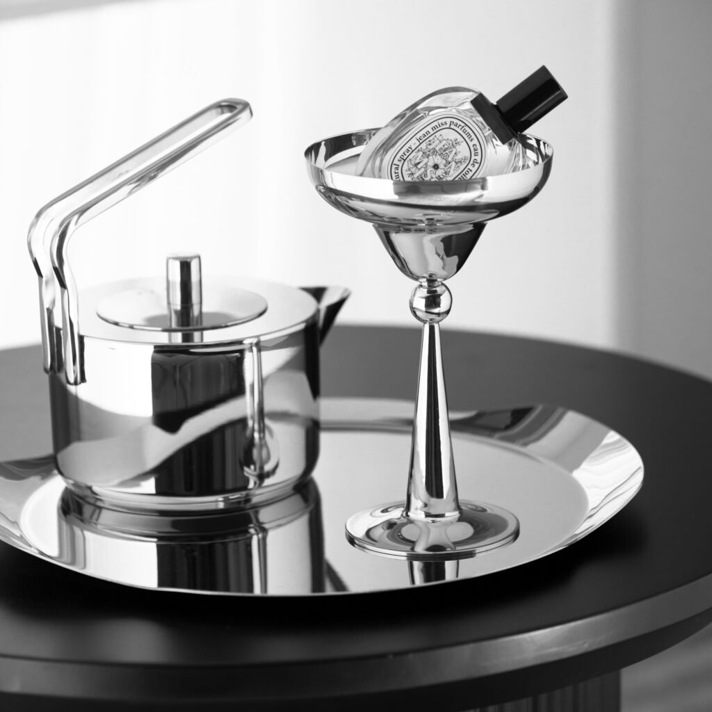 Steel Cocktail Glass (SS-88) featuring a mirror-polished Martini-style triangular bowl on a slim stem, showcased as a Luxury Mirror Polished Martini Coupe.