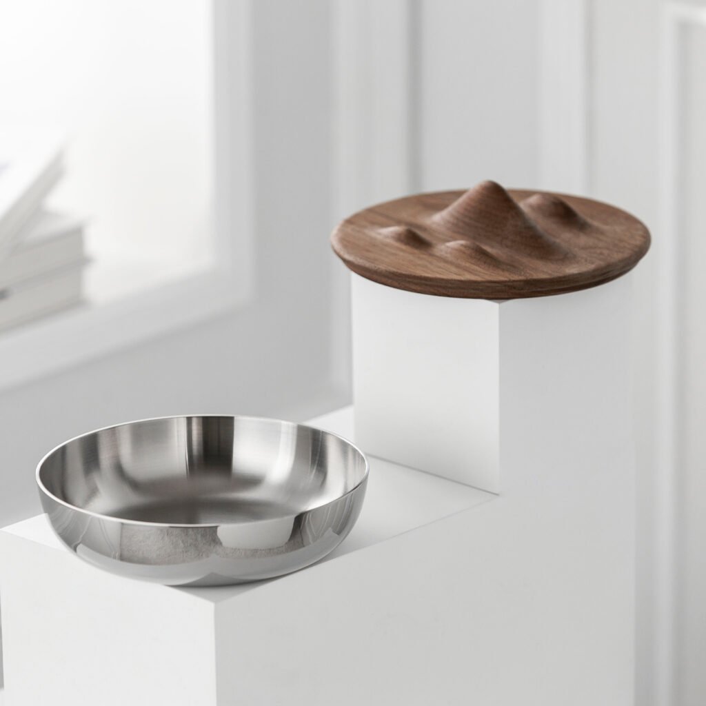 Steel Mountain Bowl (SS-09) featuring a mirror-polished body with a dramatic undulating rim mimicking mountain peaks, showcased as a Luxury Mirror Polished Peaks Basin.