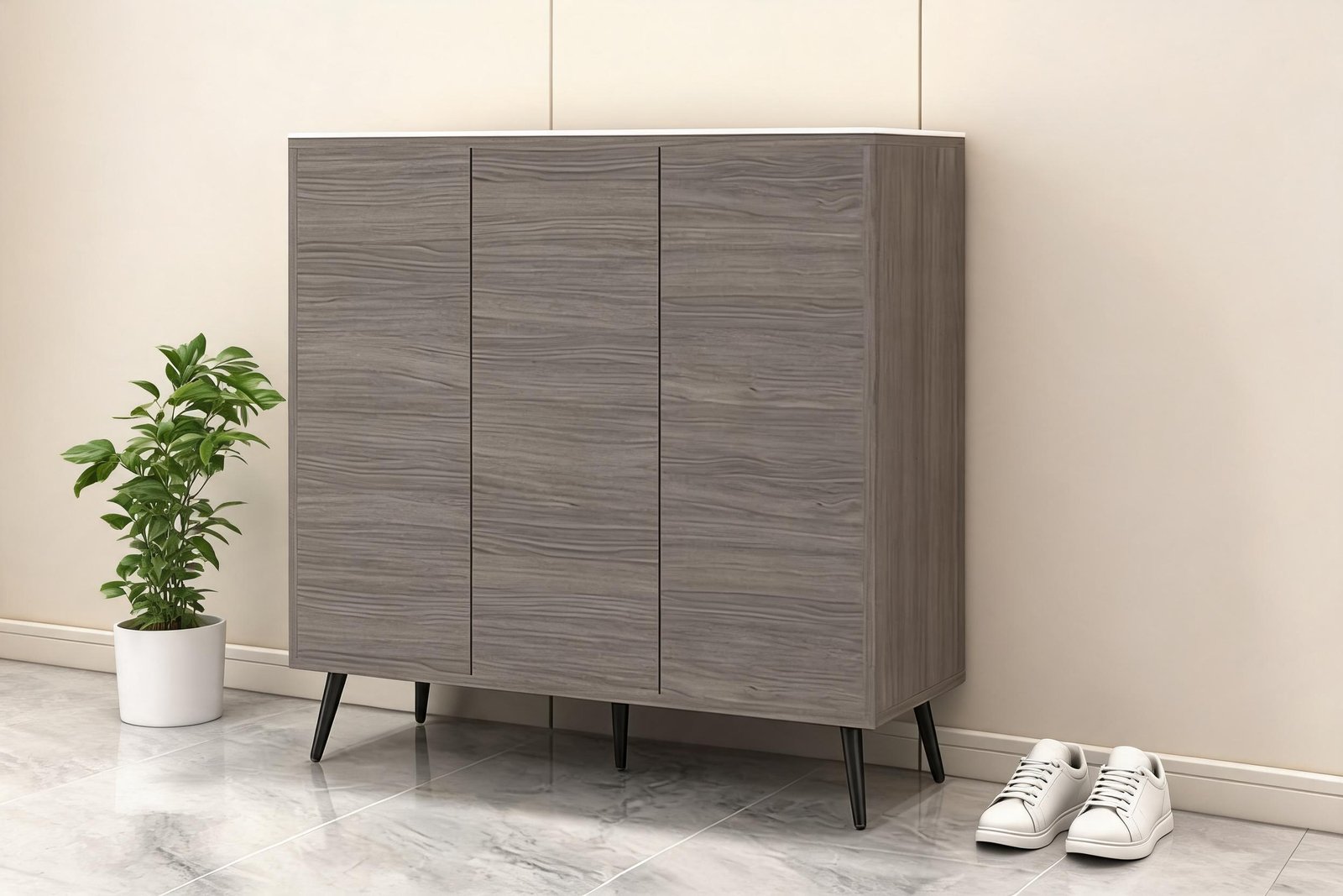 5-tier shoe storage cabinet with three handleless doors in a narrow bright entryway