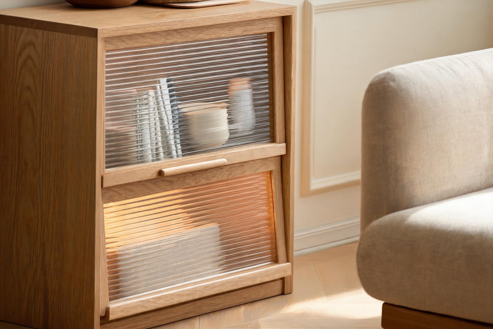 Close-up of rippled glass bookcase doors relevant to how to arrange bookshelves behind glass