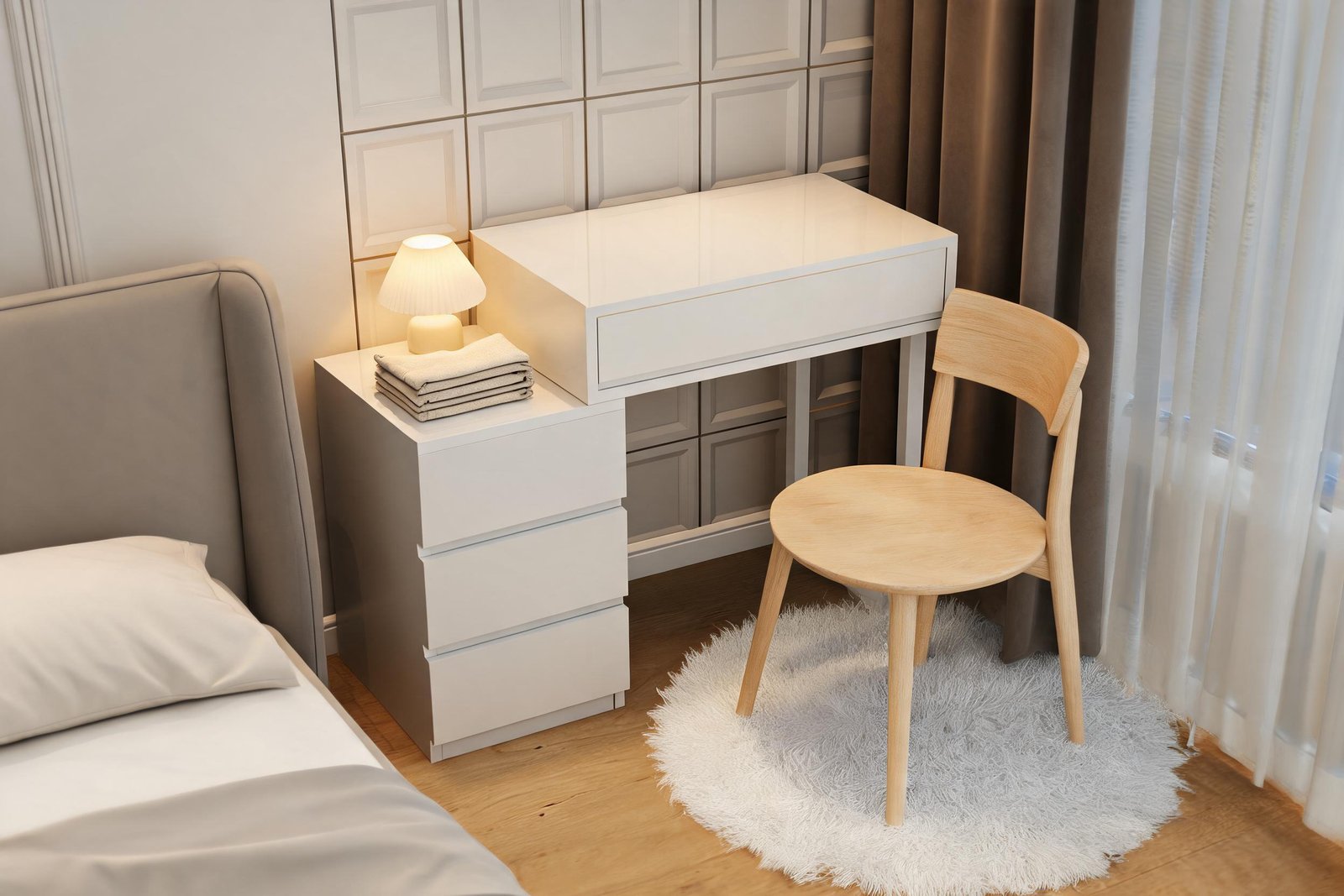 Evening view of a vanity desk for small bedroom use with a pale wood chair, a warm lamp on the cabinet and a rug in a small bedroom